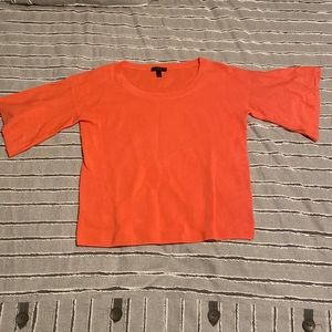 Coral J Crew sweater with a light flutter detail on the sleeves